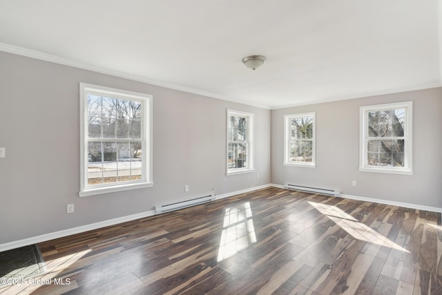 spare room featuring a baseboard radiator, dark wood finished floors, and baseboards