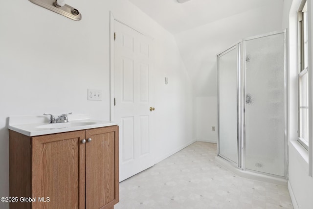 full bath with a shower stall, vanity, and tile patterned floors