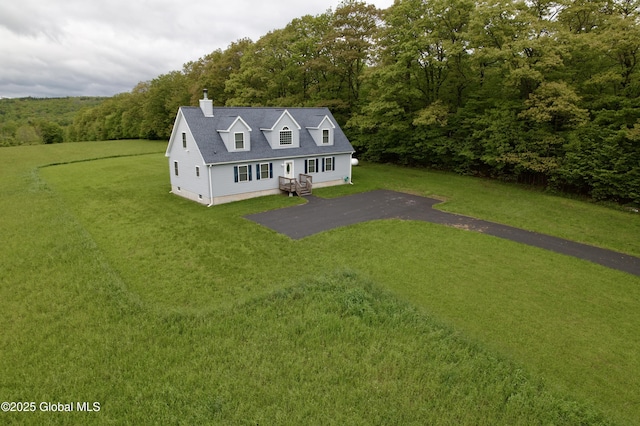 333 Ridge Rd, Broome, NY 12122 - view of front of house featuring a chimney, a forest view, and a front lawn