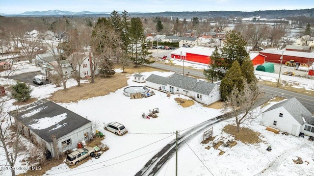 snowy aerial view featuring a residential view