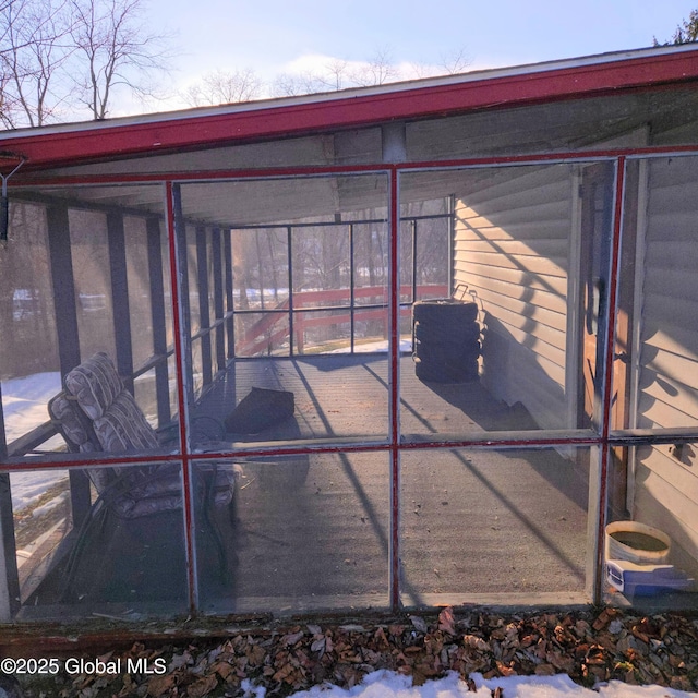 view of outbuilding with a sunroom