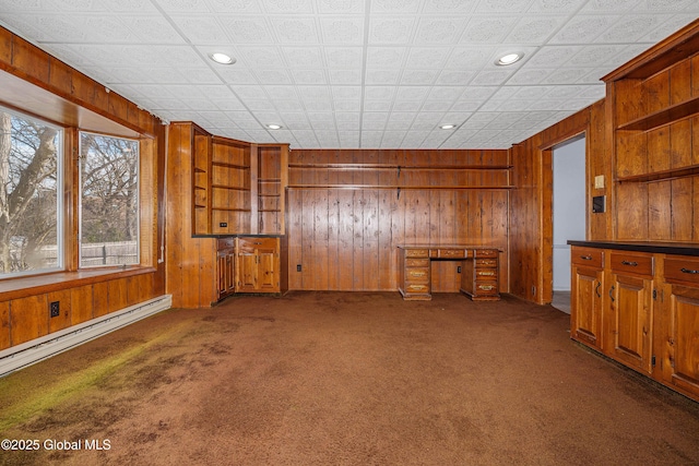 bar featuring a baseboard heating unit, carpet floors, wood walls, and recessed lighting