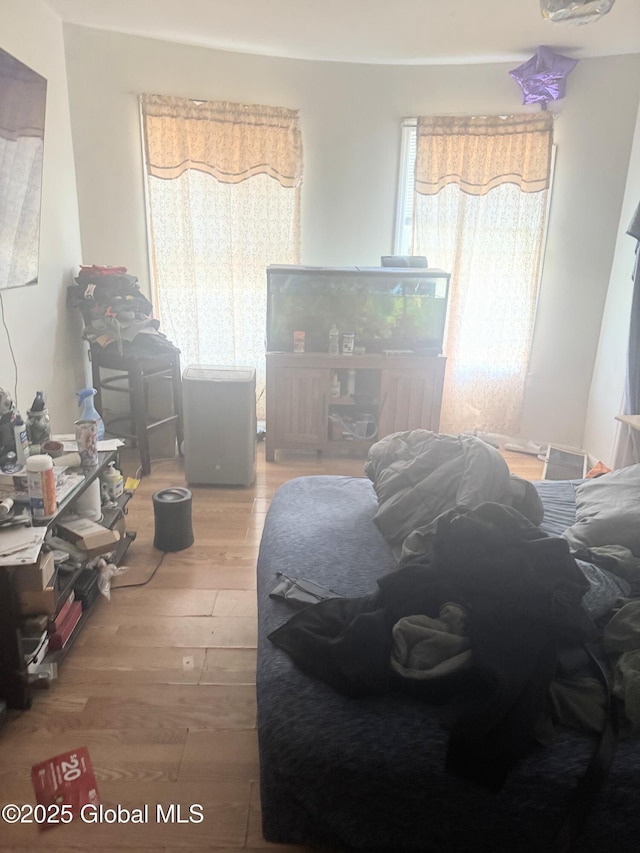 bedroom featuring wood finished floors