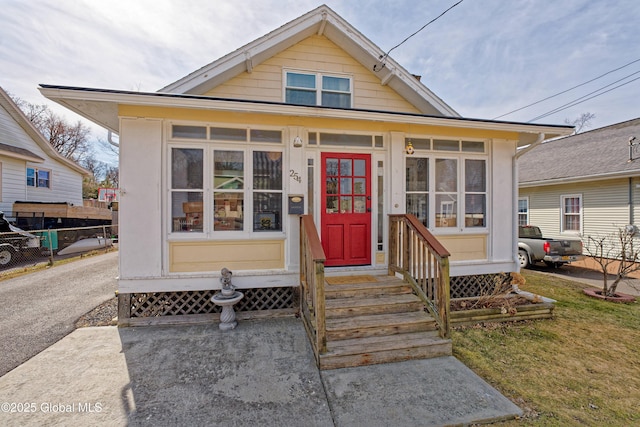 view of front of house with fence and entry steps