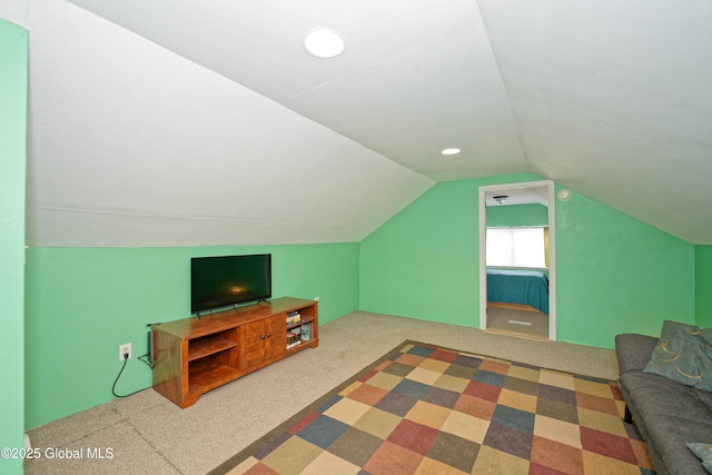 bonus room featuring carpet flooring and vaulted ceiling