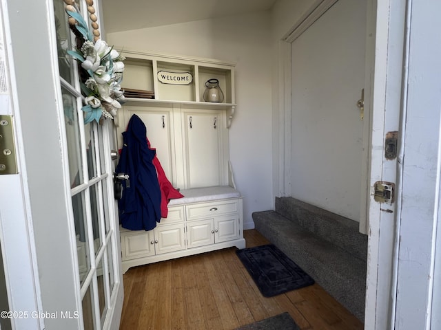 mudroom featuring lofted ceiling and wood finished floors