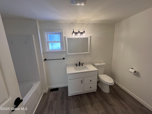 full bathroom featuring baseboards, vanity, toilet, and wood finished floors