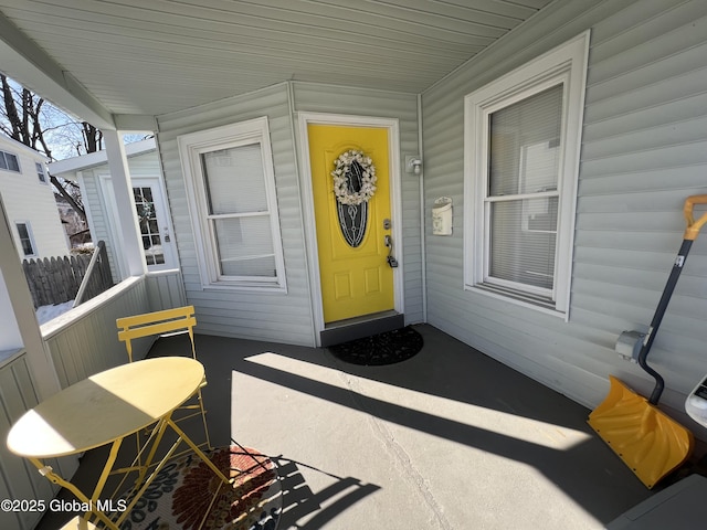 entrance to property featuring a porch