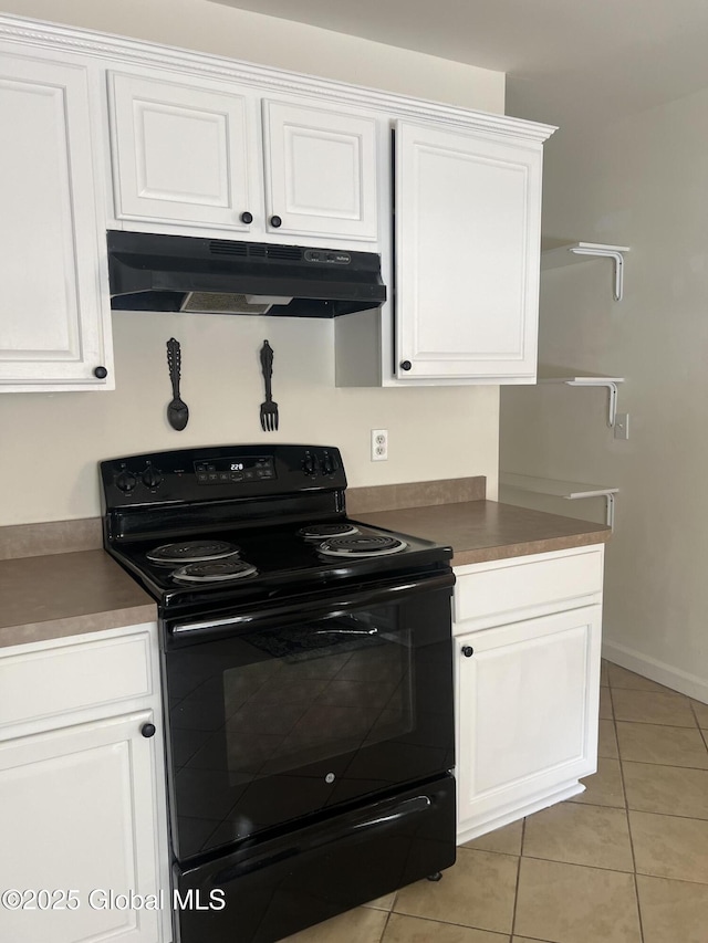 kitchen with white cabinetry, under cabinet range hood, black / electric stove, and light tile patterned floors