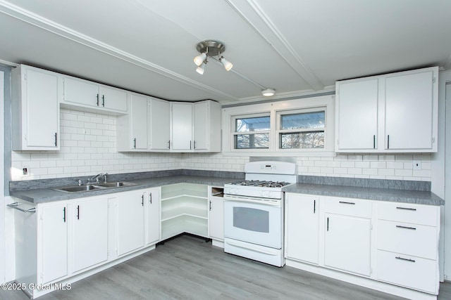 kitchen with white cabinetry, a sink, light wood finished floors, and white gas range