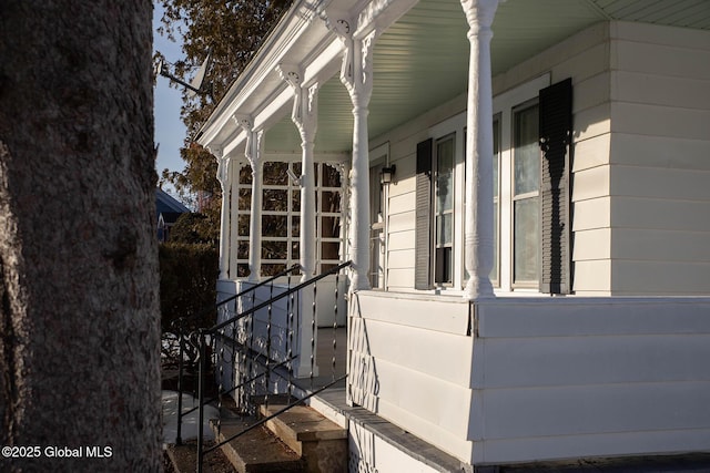 view of side of home with covered porch