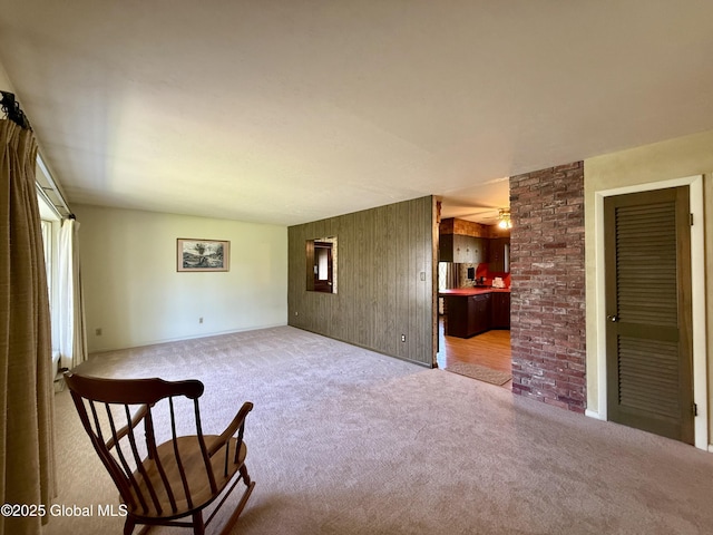24 Regina Ln, Amsterdam, NY 12010 - living area with carpet and wood walls