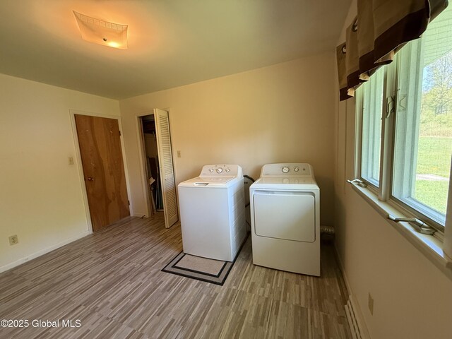 24 Regina Ln, Amsterdam, NY 12010 - washroom featuring washing machine and dryer and light wood finished floors