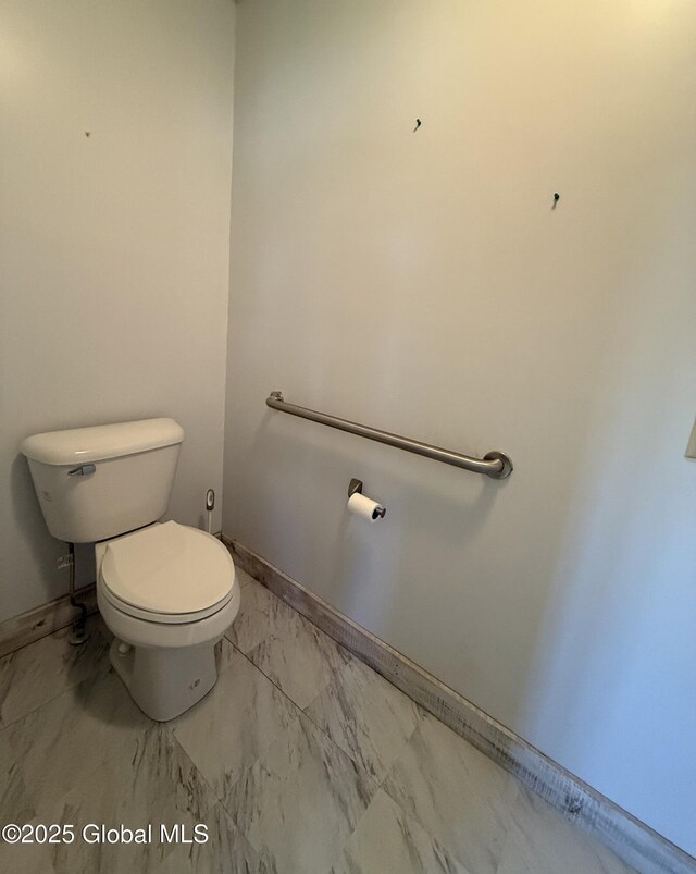 24 Regina Ln, Amsterdam, NY 12010 - bathroom with marble look tile flooring and toilet