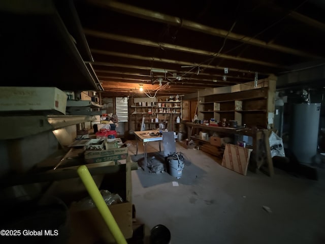 24 Regina Ln, Amsterdam, NY 12010 - unfinished basement featuring a workshop area and gas water heater
