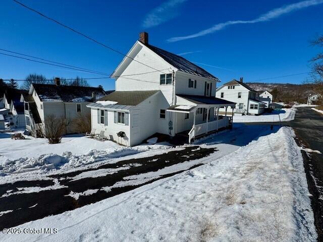 view of snow covered house