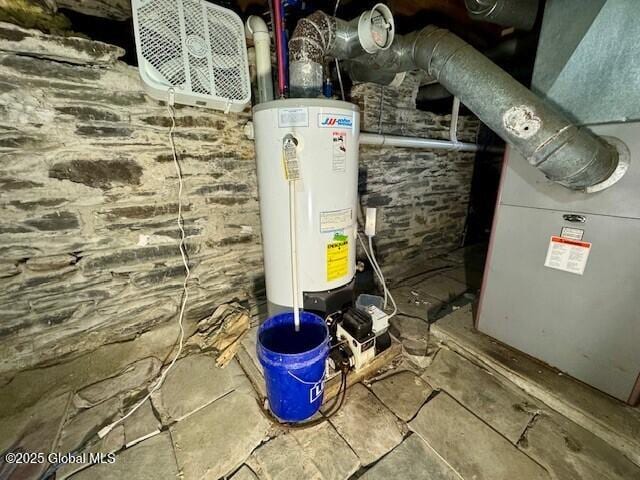 utility room with gas water heater and heating unit