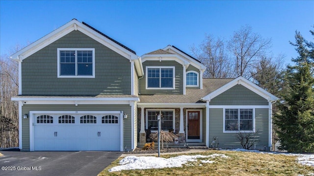 craftsman-style house with driveway and an attached garage