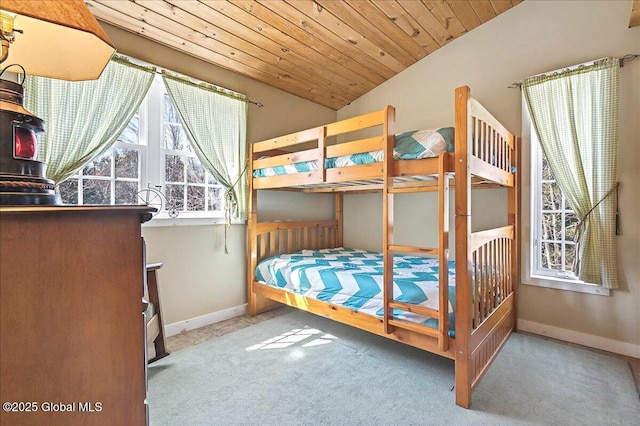 carpeted bedroom featuring wooden ceiling, baseboards, and vaulted ceiling