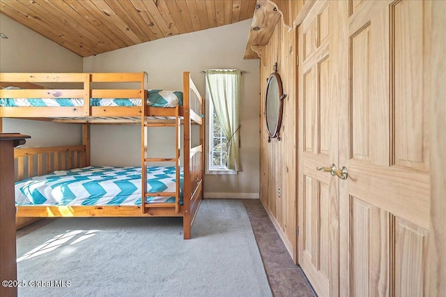 bedroom featuring lofted ceiling, carpet flooring, and wooden ceiling