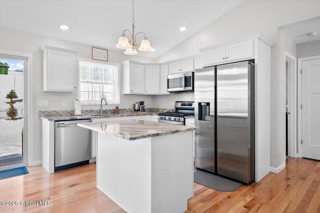 13 Alexander Way, Hudson Falls, NY 12839 - kitchen with appliances with stainless steel finishes, vaulted ceiling, white cabinetry, and a sink