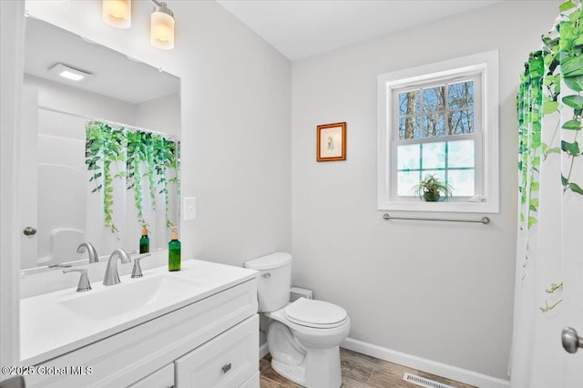 13 Alexander Way, Hudson Falls, NY 12839 - full bathroom with curtained shower, toilet, vanity, wood finished floors, and baseboards