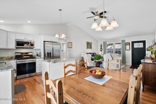 13 Alexander Way, Hudson Falls, NY 12839 - dining space with lofted ceiling, light wood-type flooring, and an inviting chandelier