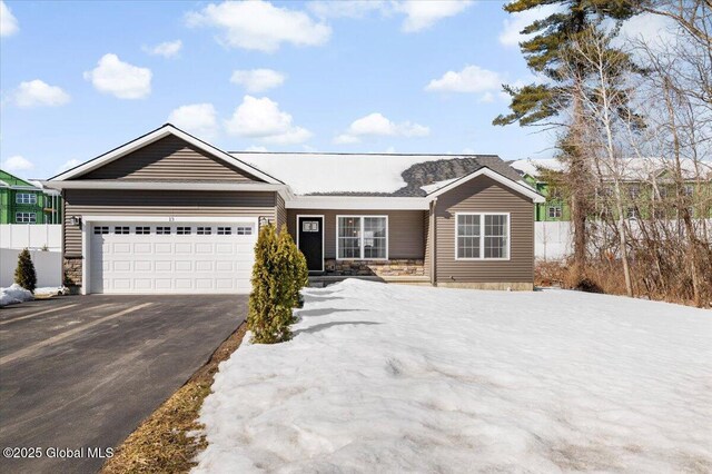 13 Alexander Way, Hudson Falls, NY 12839 - ranch-style home featuring driveway, stone siding, an attached garage, and fence