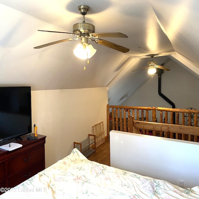 bedroom featuring lofted ceiling, ceiling fan, and wood finished floors