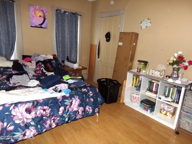 bedroom with wood finished floors