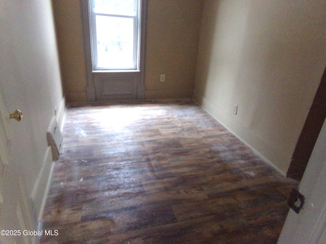 empty room with wood finished floors