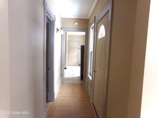 corridor featuring light wood-style floors