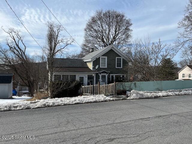 traditional-style house with a fenced front yard