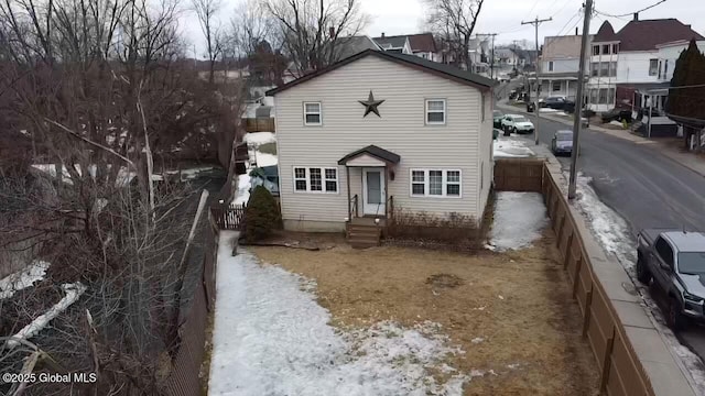 view of front facade with fence and a residential view