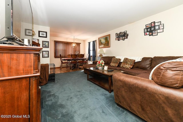 living room with dark colored carpet