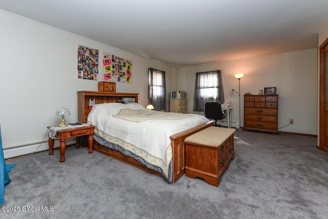 carpeted bedroom featuring a baseboard heating unit