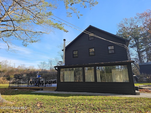 724 Green Lake Rd, Athens, NY 12015 - view of home's exterior with a sunroom, a yard, and a deck