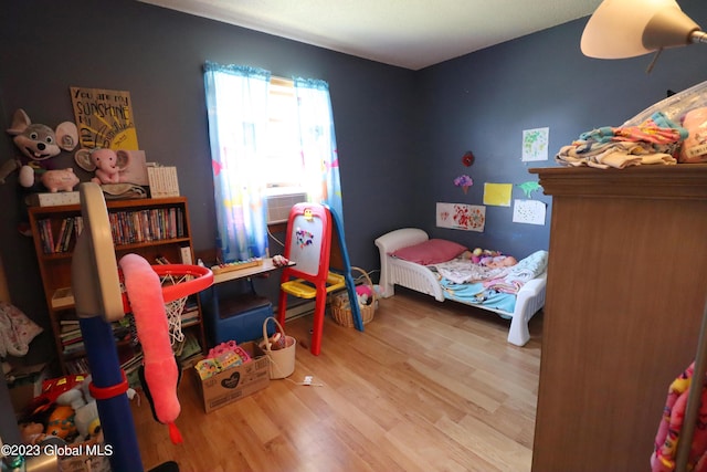 bedroom with wood finished floors