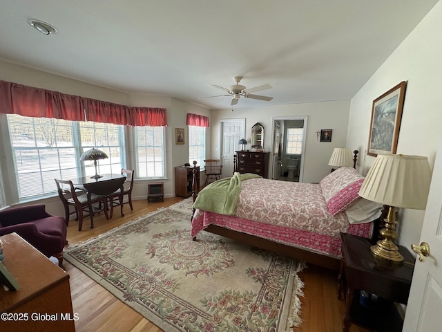 bedroom featuring wood finished floors and ceiling fan