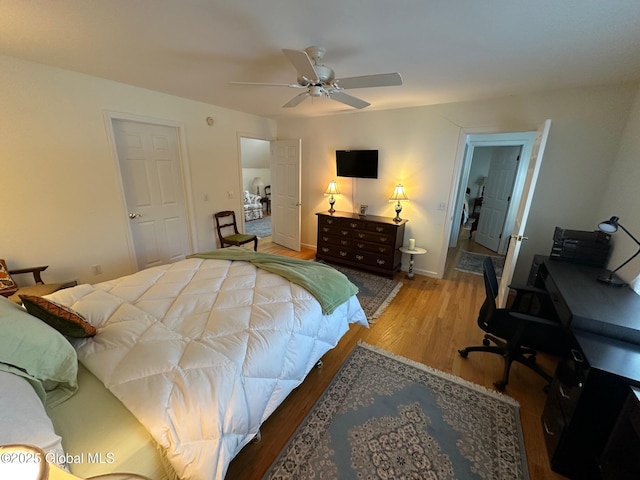 bedroom featuring wood finished floors and a ceiling fan