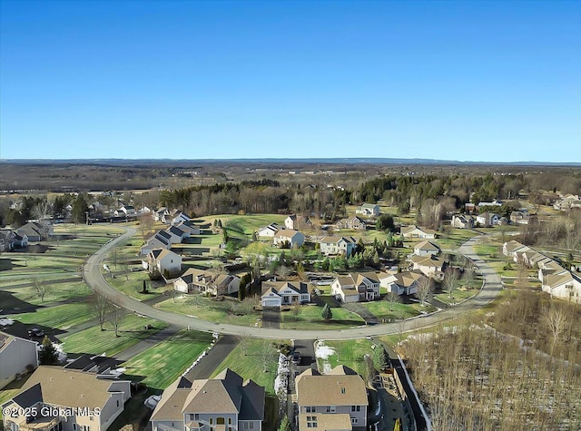 birds eye view of property with a residential view