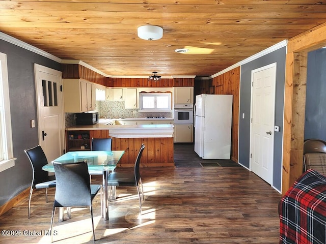 kitchen featuring wooden ceiling, white appliances, light countertops, dark wood-style floors, and crown molding