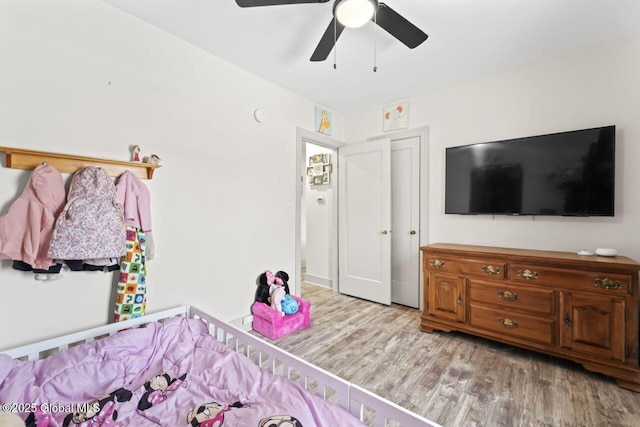 bedroom with ceiling fan and wood finished floors