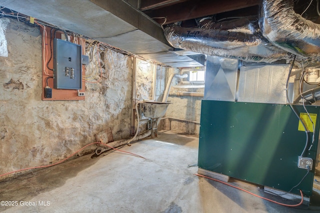 basement with electric panel and heating unit