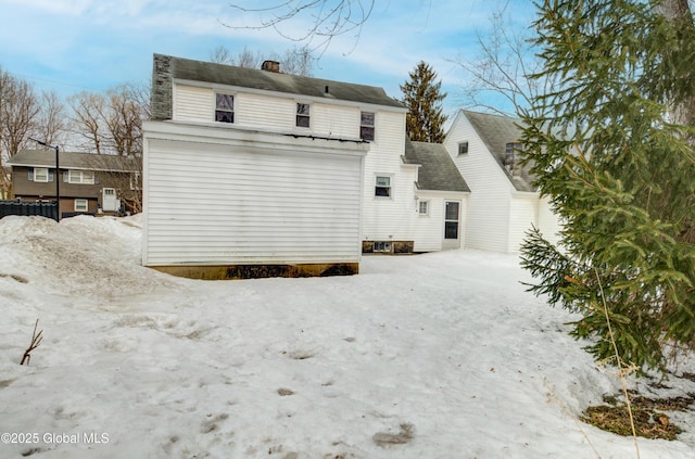 back of property featuring a chimney