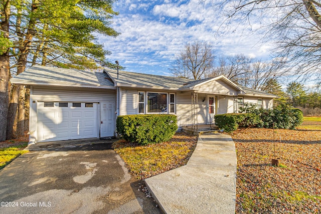 single story home featuring driveway and an attached garage