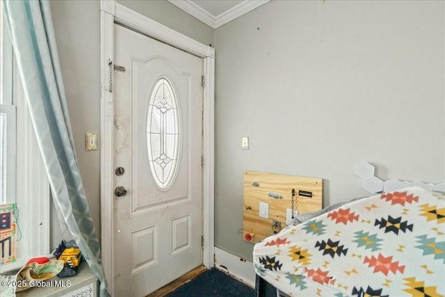 entryway featuring ornamental molding