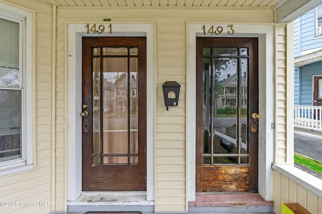 property entrance with covered porch