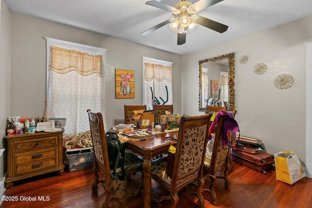 dining area featuring a textured ceiling, hardwood / wood-style floors, and a ceiling fan