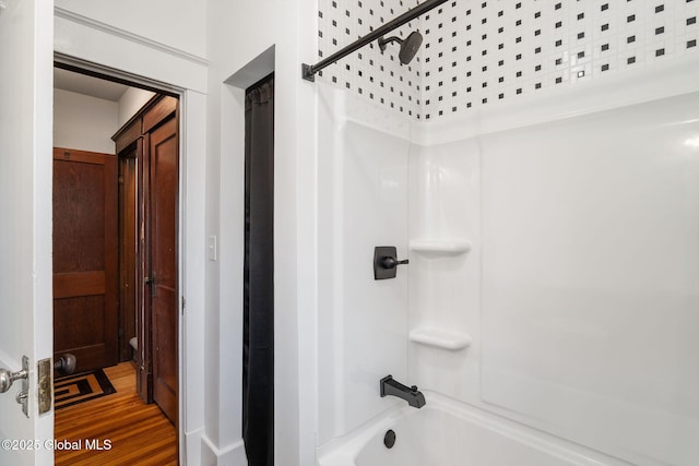 full bathroom with shower / tub combination and wood finished floors